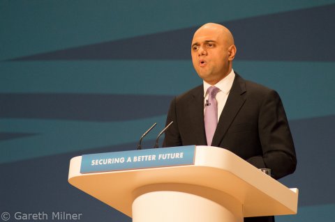 Sajid Javid's new powers: A massive threat to the NHS as we know it Sajid Javid speaking at a podium