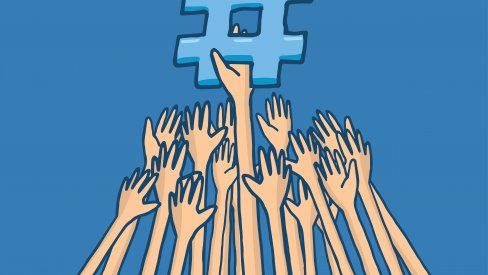 Hands reaching for a hashtag Hands reaching for a hashtag
