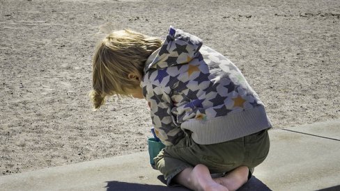 Photo of child playing at the seaside
